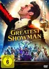 The DVD cover for the movie 'The Greatest Showman' features a large image of Hugh Jackman as P.T. Barnum looking upwards, with a crowd of performers in the background. Produktbild-Vorschau