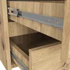 A close-up view of the interior of a wooden dresser with metal drawer slides. Podgląd zdjęcia produktu