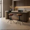 Two bar stools in a modern kitchen setting. Voir les images du produit