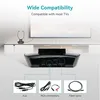 A black wireless headphone transmitter is shown on a white and light gray background, with a TV and stand in the background. The image also shows three different cable connection options. Produktbild-Vorschau