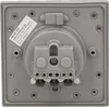 The back of a gray electrical outlet is shown, with connection terminals and labeling. Náhled obrázku produktu