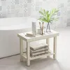 A white bathroom bench with towels on the lower shelf, placed next to a bathtub. Podgląd zdjęcia produktu