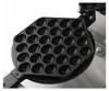 A close-up view of the top plate of a bubble waffle maker, showing its hexagonal shape and numerous circular indentations for making bubble waffles. Podgląd zdjęcia produktu