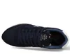 A low-angle shot of a blue sneaker on a white background. Produktbild-Vorschau