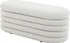A white boucle ottoman is shown from a side angle against a white background. Produktbild-Vorschau