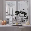 A table setting with candles and greenery, likely for a festive occasion. Produktbild-Vorschau