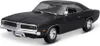 A black 1969 Dodge Charger R/T model car is shown from a three-quarter front angle against a white background. Voir les images du produit