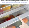 A hand is adjusting a humidity control slider inside a refrigerator drawer filled with fresh produce. Produktbild-Vorschau