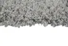 A close-up view of a shaggy gray carpet. Produktbild-Vorschau