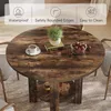 A round wooden dining table with chairs and decorative items on top, set in a room. Voir les images du produit