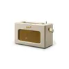 A cream-colored radio with a gold speaker grille and accents, shown against a white background. Anteprima dell’immagine prodotto