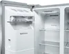 Close-up view of the interior of an open refrigerator, showing the ice maker and shelves. Náhled obrázku produktu