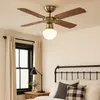 A bedroom with a ceiling fan and bed. Náhľad obrázku produktu
