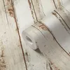 A roll of wallpaper with a wood-plank pattern. Produktbild-Vorschau