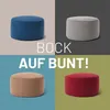 A collage of four different colored poufs, with text overlay. Produktbild-Vorschau