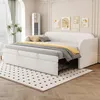A white sofa bed is shown in a room with decorative wall art and a tall white air conditioner unit. Podgląd zdjęcia produktu