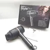 A hairdryer and its packaging are displayed on a white surface. Podgląd zdjęcia produktu