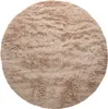 A round, shaggy rug with a beige and brown color scheme, presented on a white background. Anteprima dell’immagine prodotto
