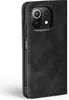 A black flip case for a smartphone is shown from the side. Produktbild-Vorschau