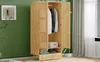 A wooden wardrobe with its doors open, displaying clothes and a box inside, set against a green wall with a framed picture and a window with blinds in the background. Anteprima dell’immagine prodotto