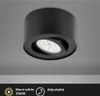 A black LED ceiling light fixture mounted on a light gray ceiling. Voir les images du produit