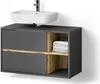 A modern bathroom vanity with a sink and faucet above it. The vanity is dark gray with wood-grain accents and open shelving holding folded towels. Produktbild-Vorschau