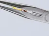 A close-up shot of needle-nose pliers holding a stripped electrical wire. Anteprima dell’immagine prodotto