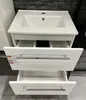 A white bathroom vanity with a sink and open drawers. Náhled obrázku produktu