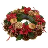 A Christmas advent candle holder wreath decorated with pine cones, red poinsettias, berries, and gold accents. Podgląd zdjęcia produktu