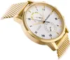 A close-up, angled shot of a gold Tommy Hilfiger watch with a white face. Voir les images du produit