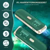A close-up of two green hair removal devices with gold trim, against a dark, textured green background. The devices have digital displays showing numbers and symbols. Produktbild-Vorschau