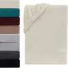 A stack of folded blankets in various colors is shown on the left, and a single cream-colored blanket is displayed on the right, folded and draped. Produktbild-Vorschau