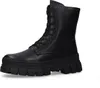 A black leather boot with a thick sole is shown against a white background. Produktbild-Vorschau