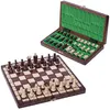 A wooden chess set with pieces on the board and in the open case. Anteprima dell’immagine prodotto