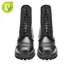 A pair of black leather boots on a white background. Produktbild-Vorschau
