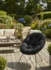 A garden patio with furniture and flowers. Produktbild-Vorschau