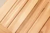 A close-up view of wooden planks arranged diagonally. Produktbild-Vorschau