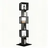 A tall, black, rotating bookshelf with multiple cubic shelves, some containing decorative items and books, against a white background. Produktbild-Vorschau