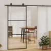 A modern interior with a sliding glass door, dining table, chairs, and a plant. Anteprima dell’immagine prodotto