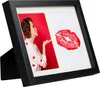 A black multi-picture frame with a photo of a woman blowing a kiss and a red lipstick kiss imprint. Náhled obrázku produktu