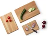 Three wooden cutting boards with various vegetables on them, arranged on a white background. Voir les images du produit