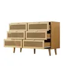 A wooden dresser with rattan woven drawer fronts and wooden legs, shown against a white background. Anteprima dell’immagine prodotto