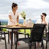 A couple enjoying a meal at an outdoor dining table on a deck with a scenic mountain view. Produktbild-Vorschau