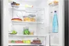 Interior view of an open refrigerator filled with food and drinks. Produktbild-Vorschau