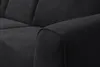 A close-up view of the armrest and seating area of a dark gray sofa. Voir les images du produit