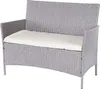 A poly-rattan garden bench with a cream cushion. Podgląd zdjęcia produktu