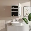 A modern bathroom scene featuring a white medicine cabinet with an open door, a white vessel sink with a black faucet, and a large green plant. Náhľad obrázku produktu