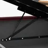 Close-up view of a gas spring mechanism attached to a bed frame. Produktbild-Vorschau
