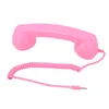 A pink retro telephone handset with a coiled cord and a 3.5mm jack is displayed against a white background. Náhľad obrázku produktu