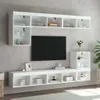A white TV cabinet and wall-mounted shelves are displayed against a gray wall. Produktbild-Vorschau
